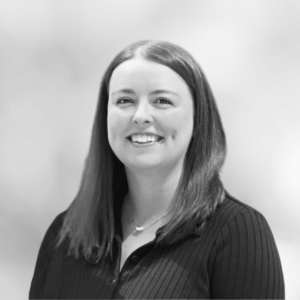 Dorthy Wood, Senior Director of Client Success and Operations at Braintrust Growth, smiling in a professional setting, emphasizing her role in enhancing sales performance and leadership development.
